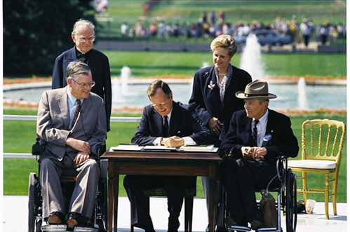President Bush signing the ADA into law