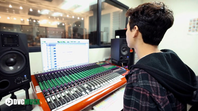 Student at a mixing console
