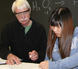 Leon Borowski helps a student
