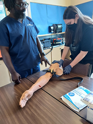 A student and instructor at health careers academy.