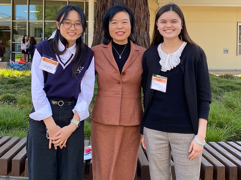 Chinese Professor Huiqin An with students Bernice Leung (left) and Kira Daly (right) at the 2025 CLTAC Mandarin Speech Contest.
