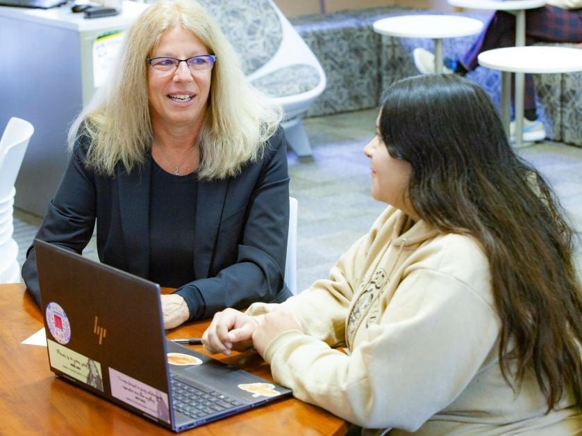 Robin Heinemann talks with a student about the WIOA Grant