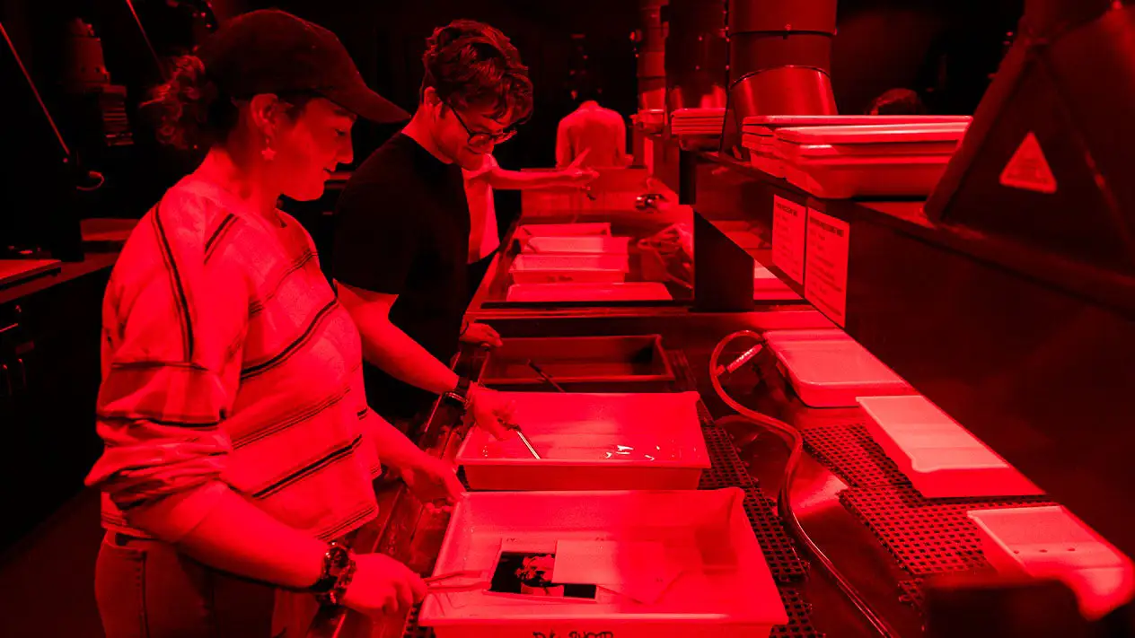 DVC Photography Students in a Darkroom.