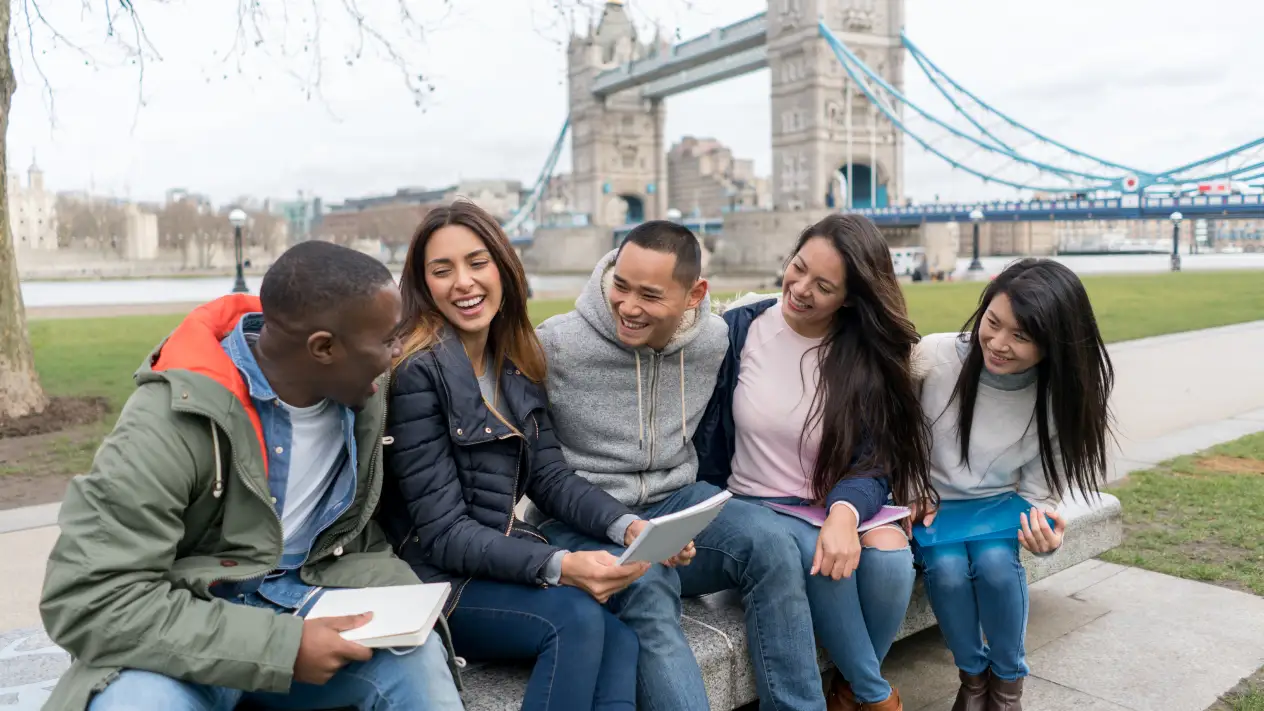 Study Abroad students hanging out in a park.