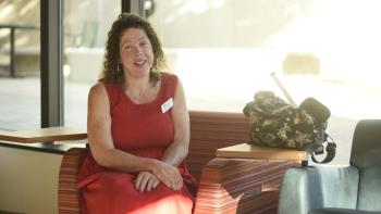 Visually-impaired DVC alum and special education and paraprofessional studies major Jaime Tomasello sitting in a chair