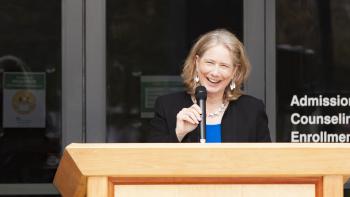 DVC President Susan Lamb speaking at a podium
