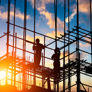 People working on scaffold in shadows