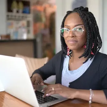 Student typing on a computer