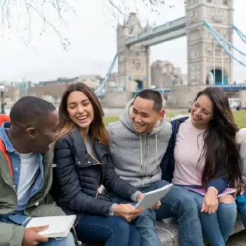 Study Abroad students hanging out in a park.