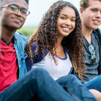 A group of students hanging out outside.