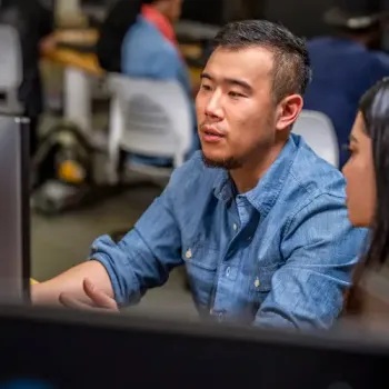 Teacher and student working online.