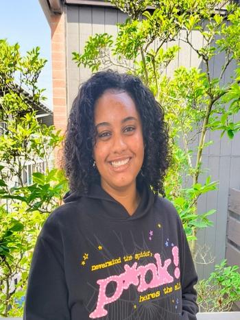 Smiling DVC student Luwam Amanuel standing outdoors on campus.