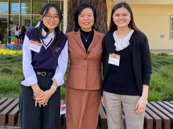 Chinese Professor Huiqin An with students Bernice Leung (left) and Kira Daly (right) at the 2025 CLTAC Mandarin Speech Contest.