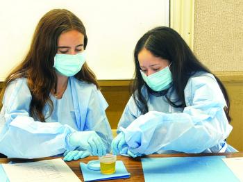 Students performing a lab test in the DVC Health Career Academy