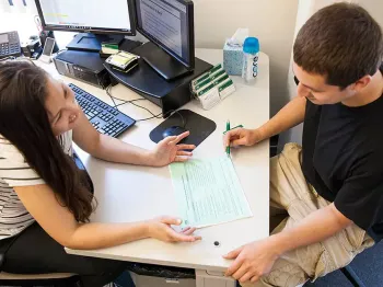 A student works with a tutor in one of DVC's student centers.