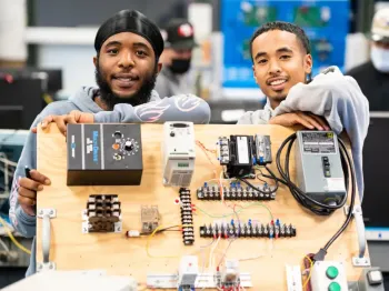Students with electronics.